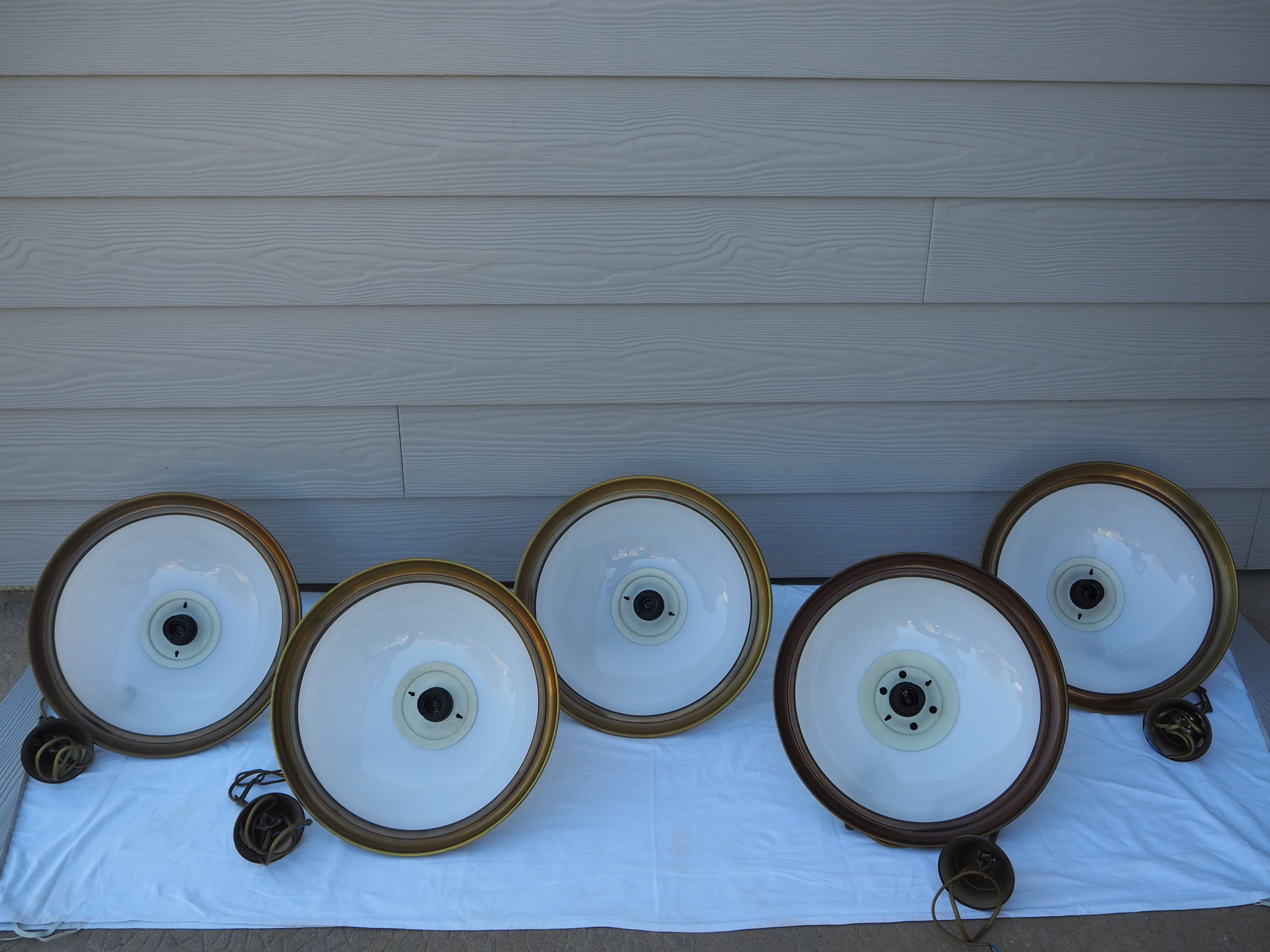 Suspension in white opaline, its edge in aged brass