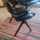 Two black leather armchairs