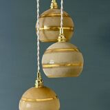 Suspension triple vintage glass globes in frosted yellow and gold.
