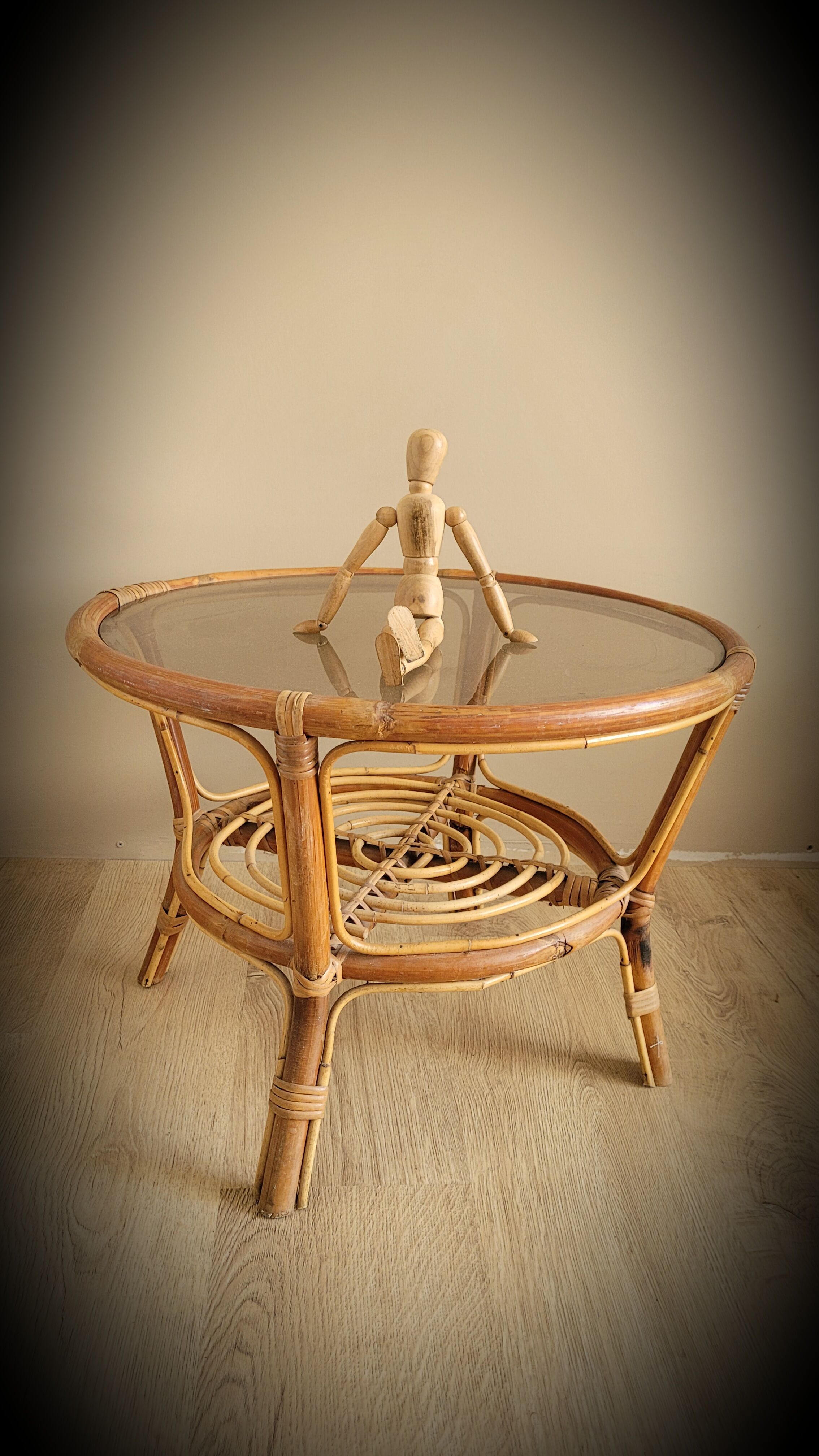 Light rattan lounge table and smoked glass