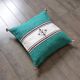 Moroccan Berber cushion in green and white.