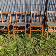 Set of four wooden bistro chairs, green seat, mid-20th century.