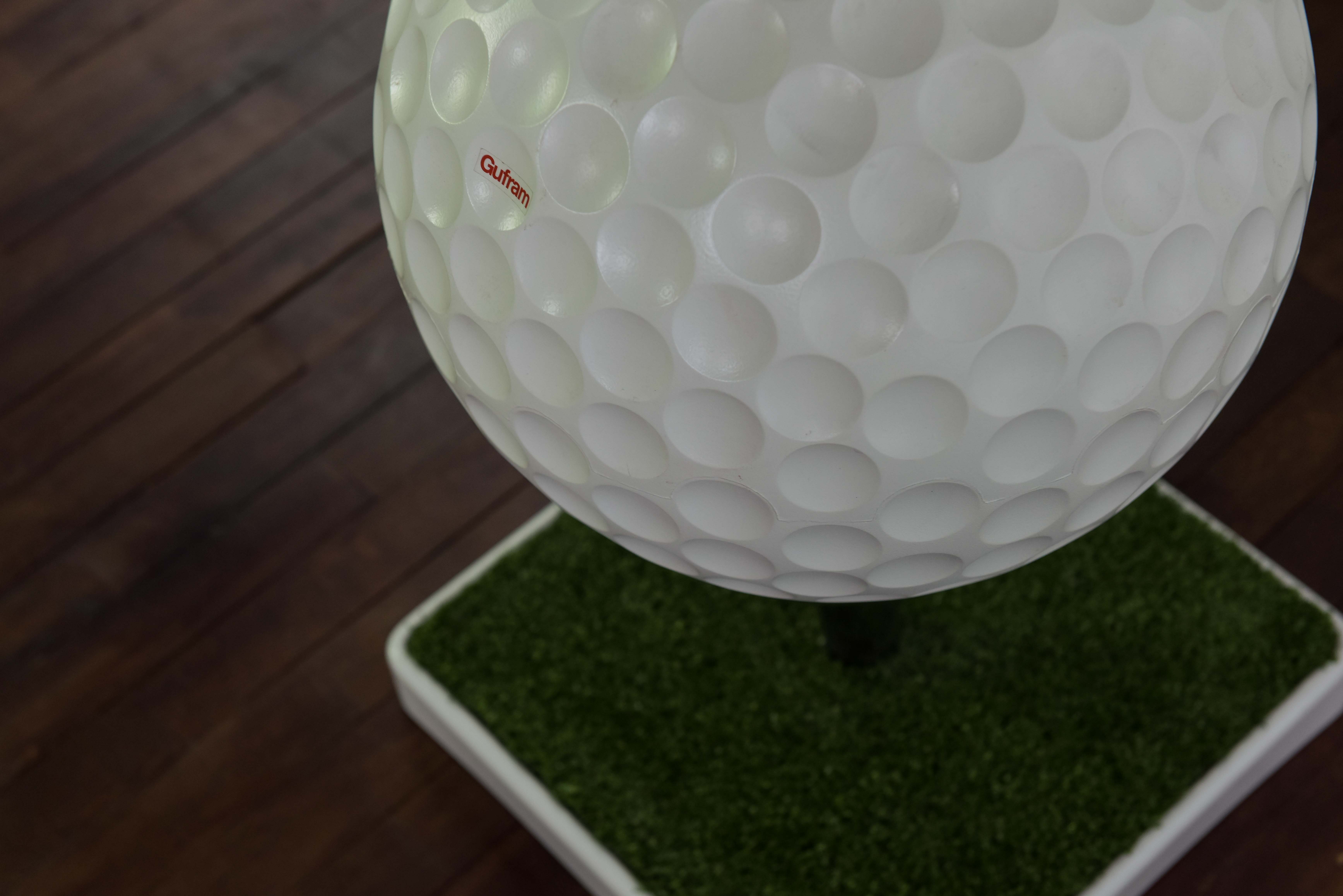Sedie-Tee seat produced by Gufram in form of a golf ball set on a tee
