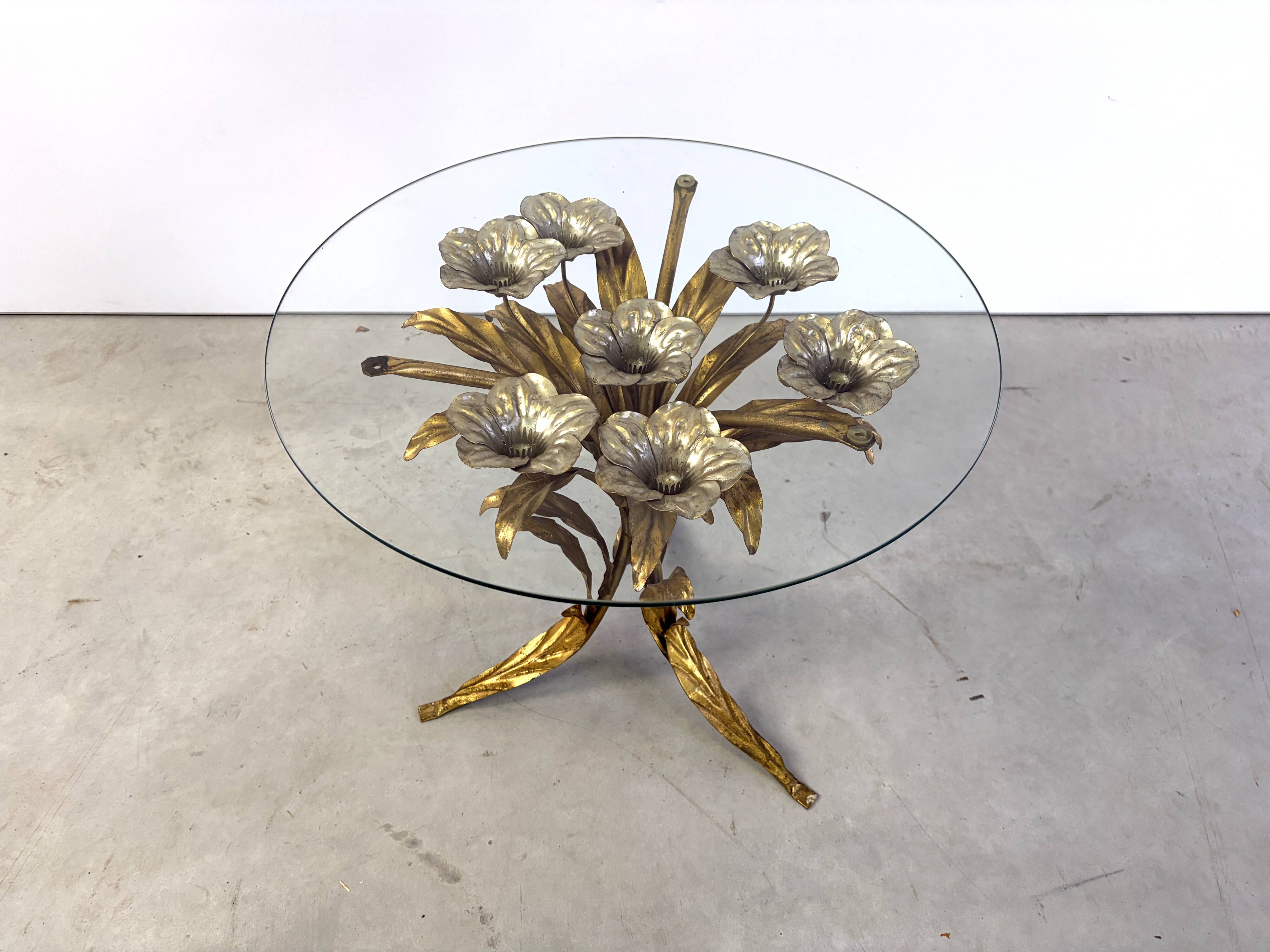 Charming metal flower coffee table or side table with a clear glass top. Made in Italy, attributed to Hans Kögl.
