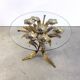 Charming metal flower coffee table or side table with a clear glass top. Made in Italy, attributed to Hans Kögl.