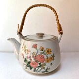 Vintage teapot in stoneware handle in rattan