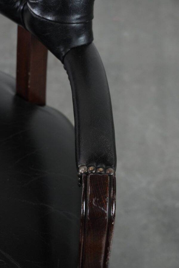 Adjustable black timeless Chesterfield office chair made of cow leather