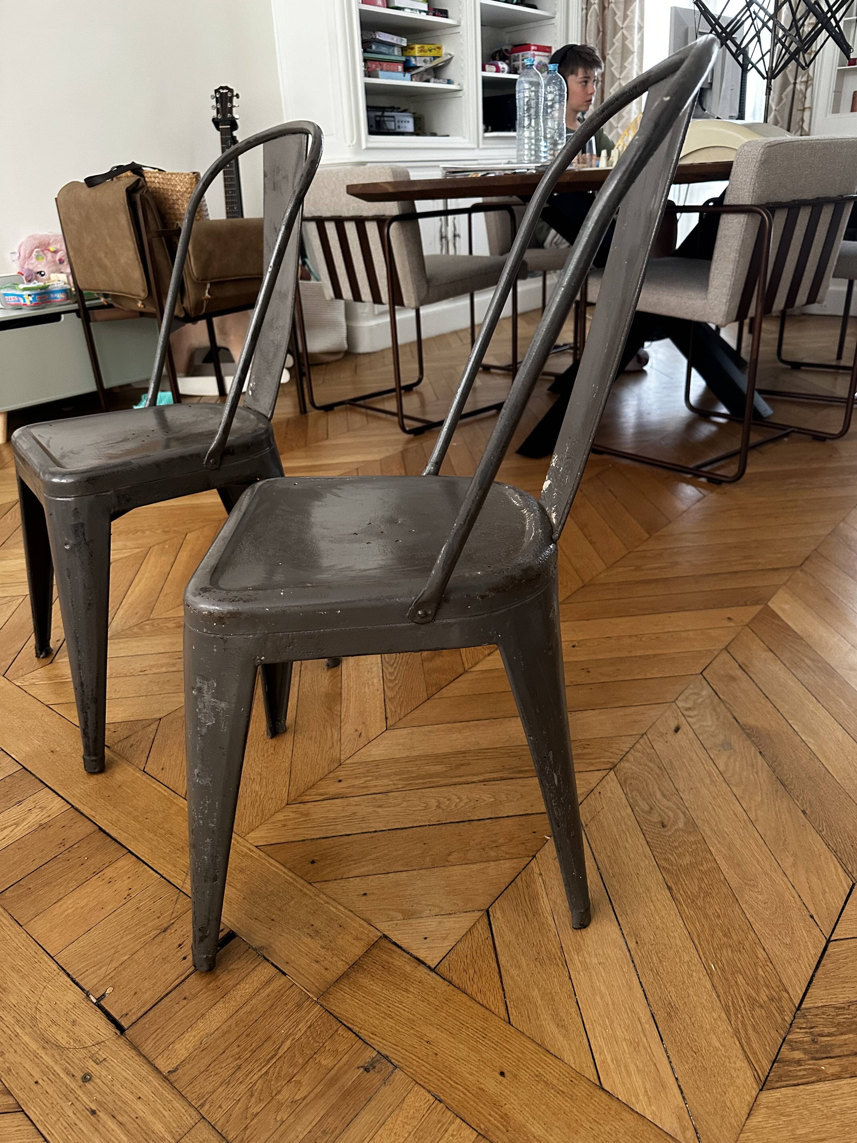 Pair of vintage Tolix model A chairs, designed by Xavier Pauchard.