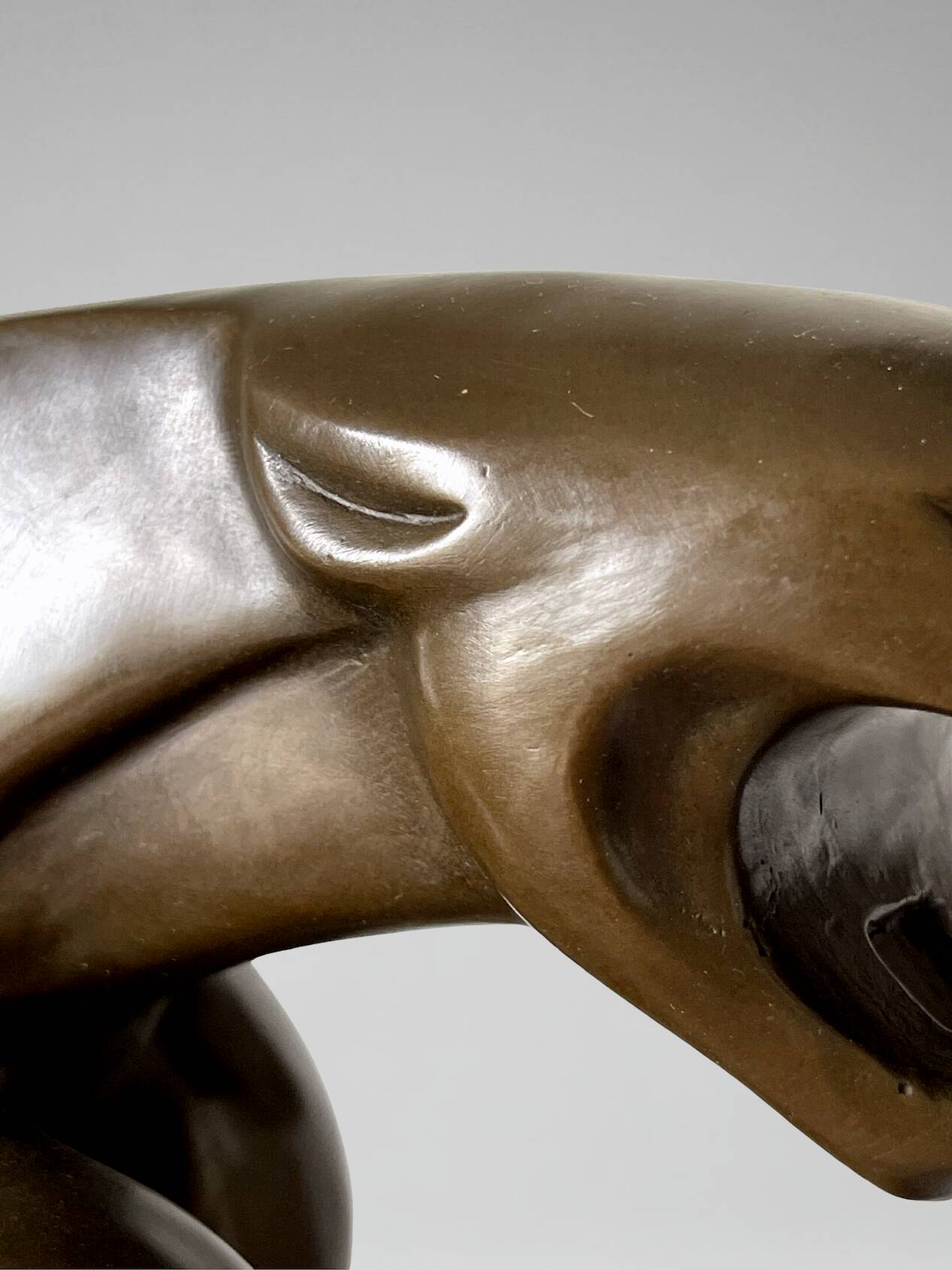 Large Art Deco bronze patinated Jaguar sculpture on an architectural base.