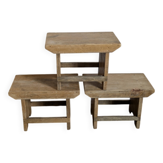 Trio of handcrafted blond wood stools