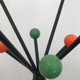 Wearing chrome parrot coat, black and multicolored balls