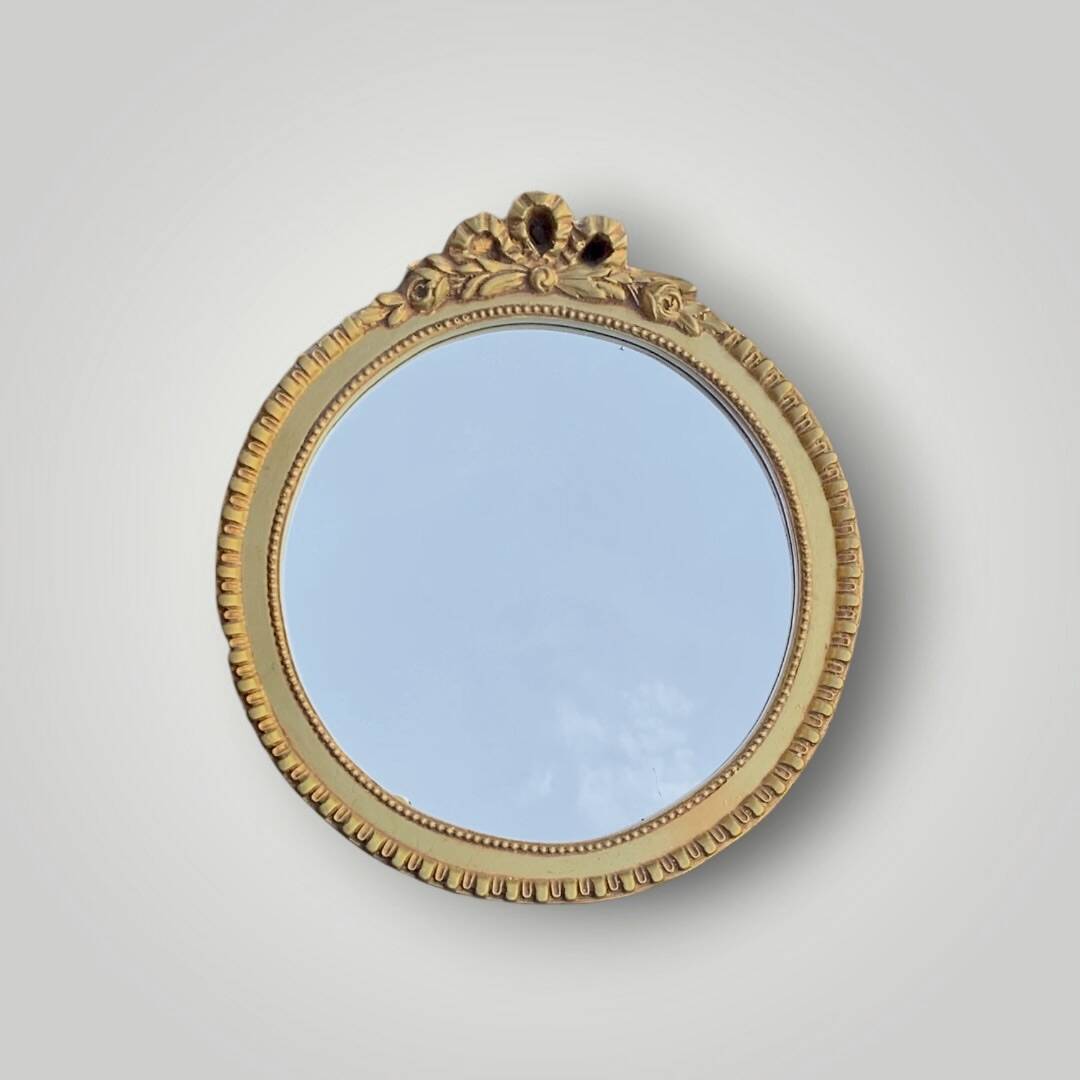 Antique small round wall mirror in gold resin - love knot