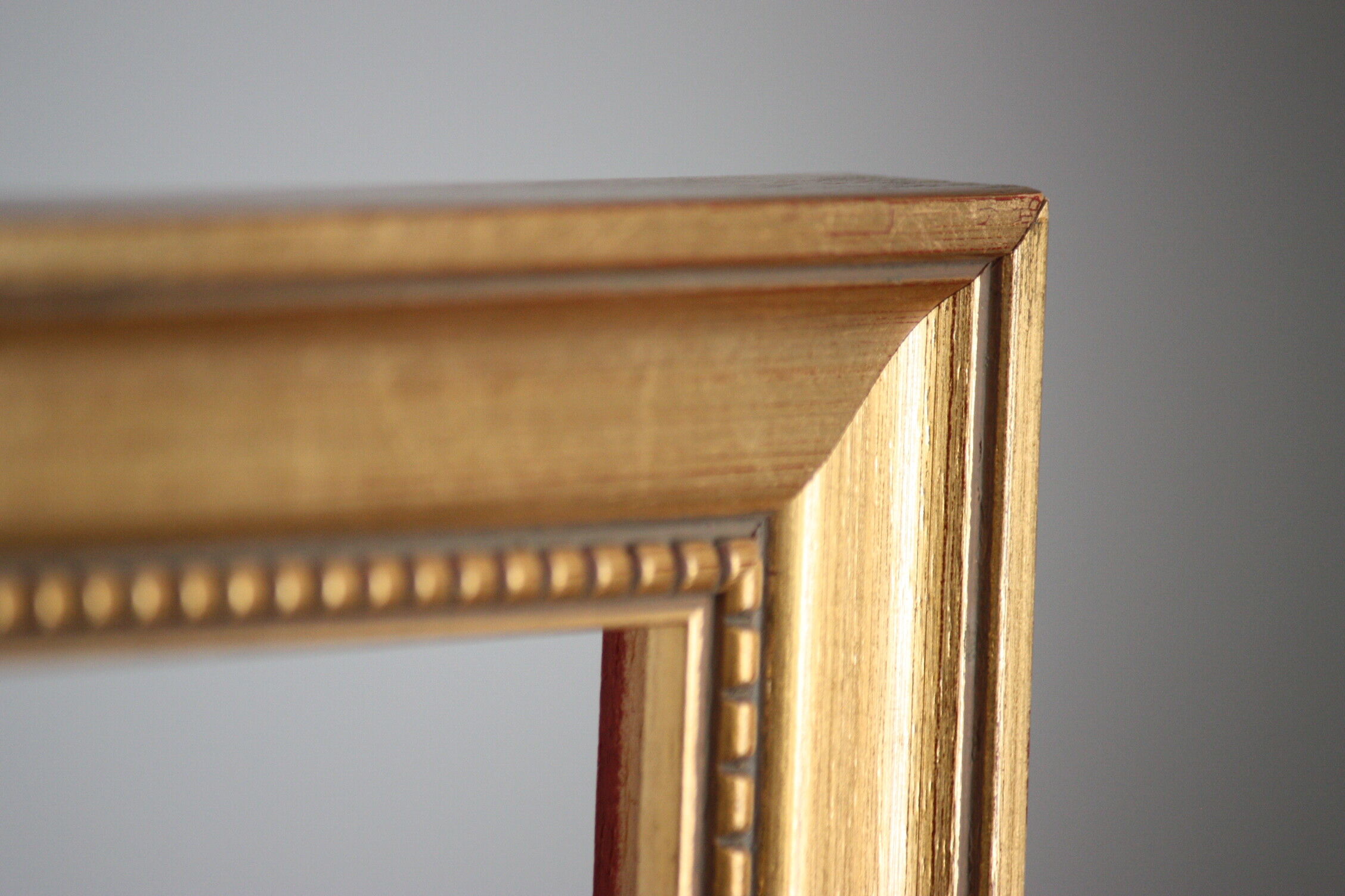 Carved and moulded gilded wood frame