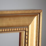 Carved and moulded gilded wood frame