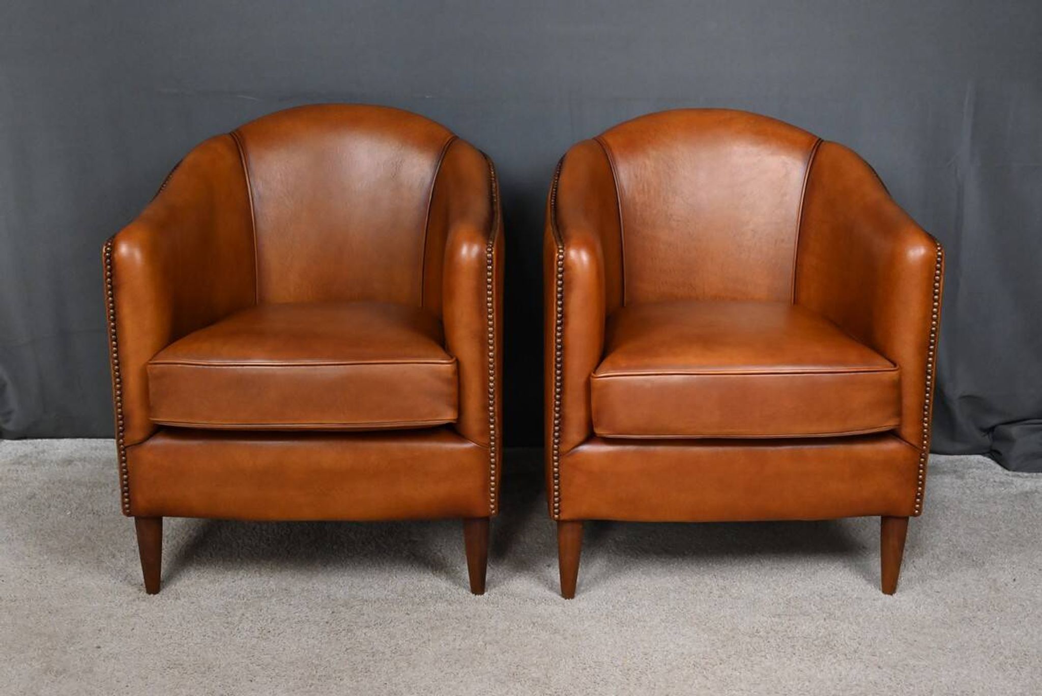 Pair of Solange club armchairs in sheepskin leather – reproduction