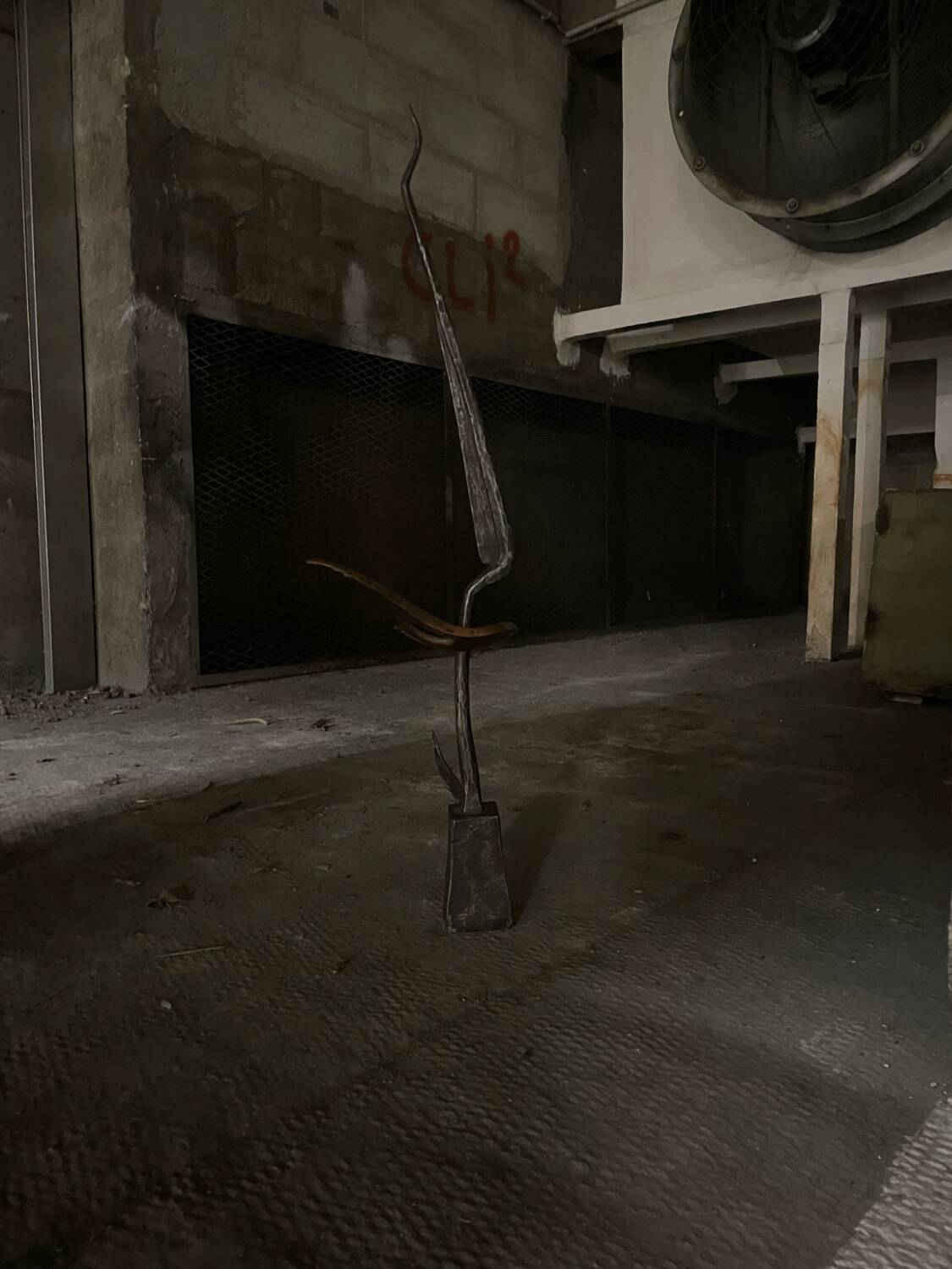 Signed hammered metal and copper sculpture