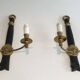 Pair of black lacquered bronze wall sconces decorated with lion heads