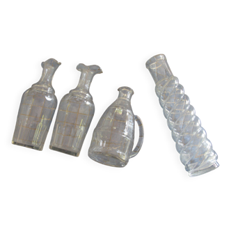 Set of 4 white glass carafes