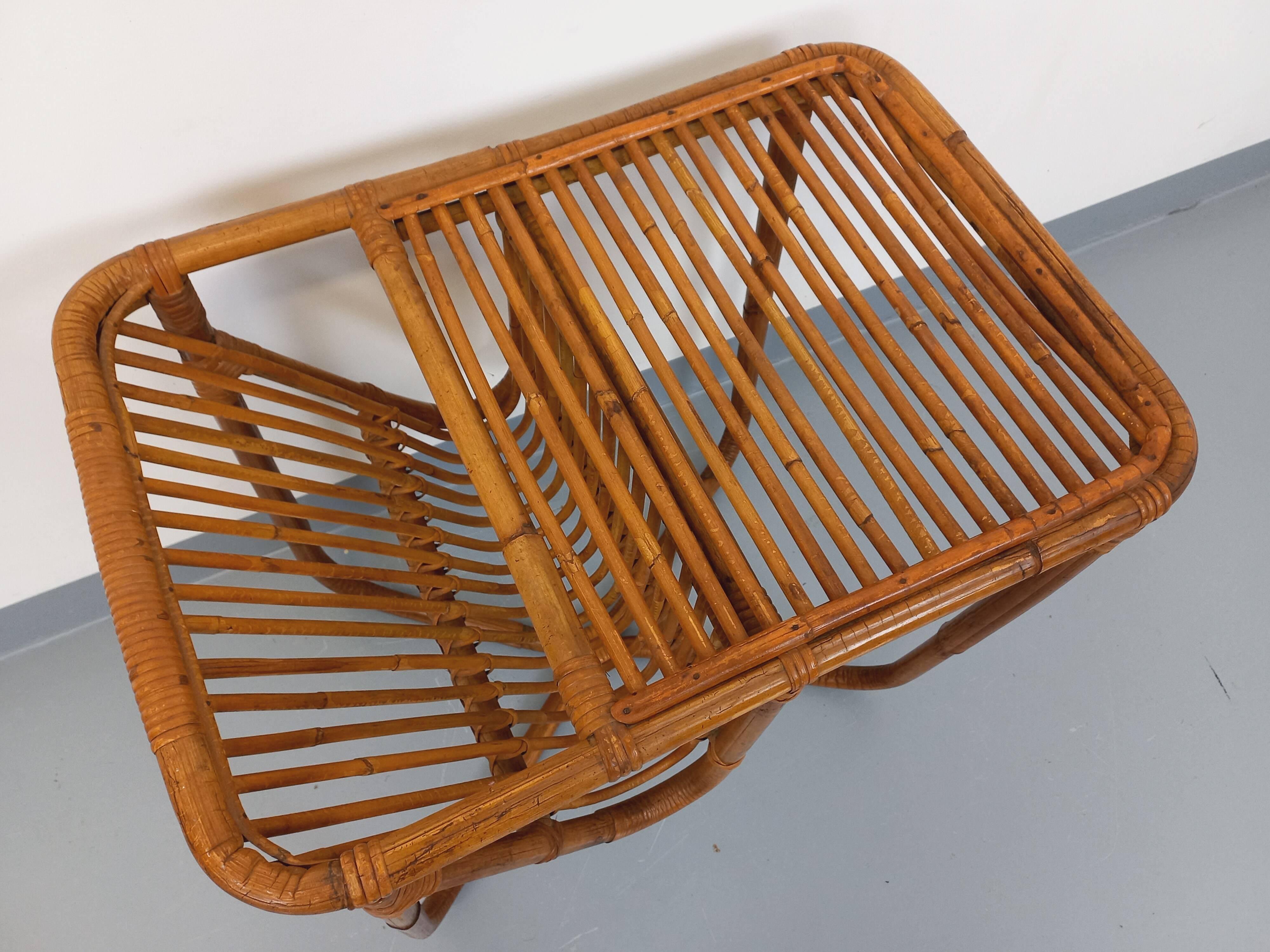 Side table / coffee table with vintage 1960s rattan magazine rack.