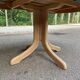 Renovated Scandinavian dining table in solid oak with a central leg from the 1970s.