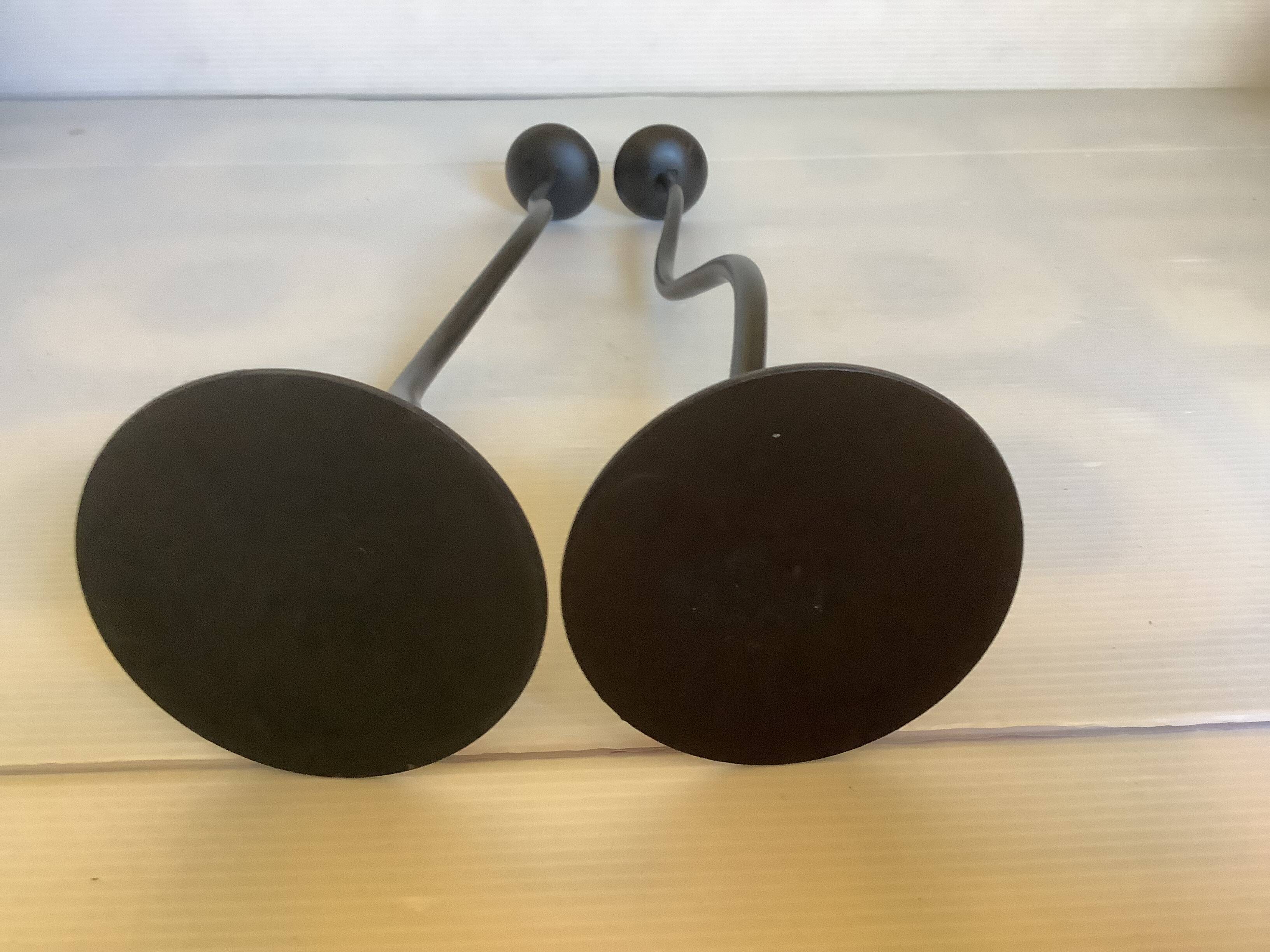 Pair of black hysteria-style candlesticks