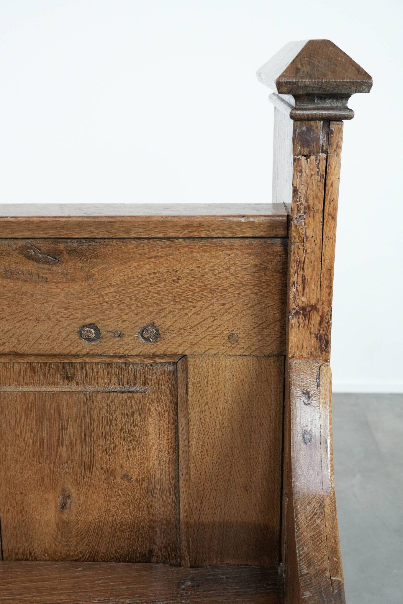 Antique oak church bench in Gothic style with beautiful wood carving