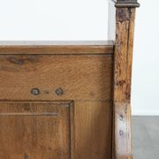 Antique oak church bench in Gothic style with beautiful wood carving