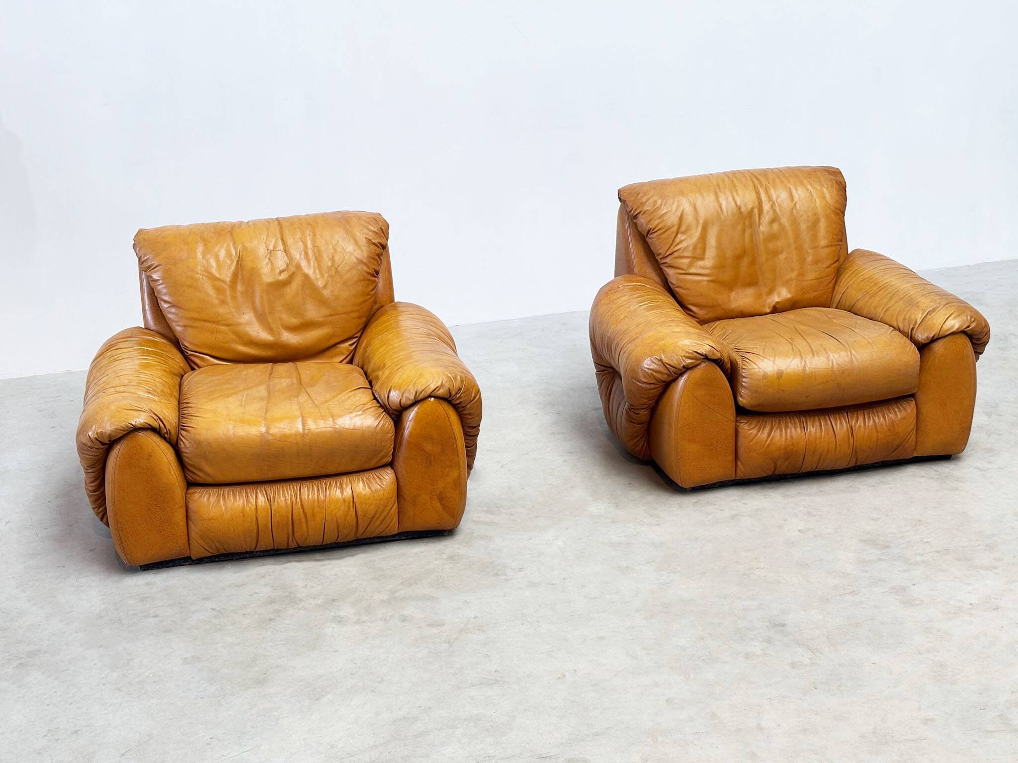 Set of two Italian cognac leather lounge chairs