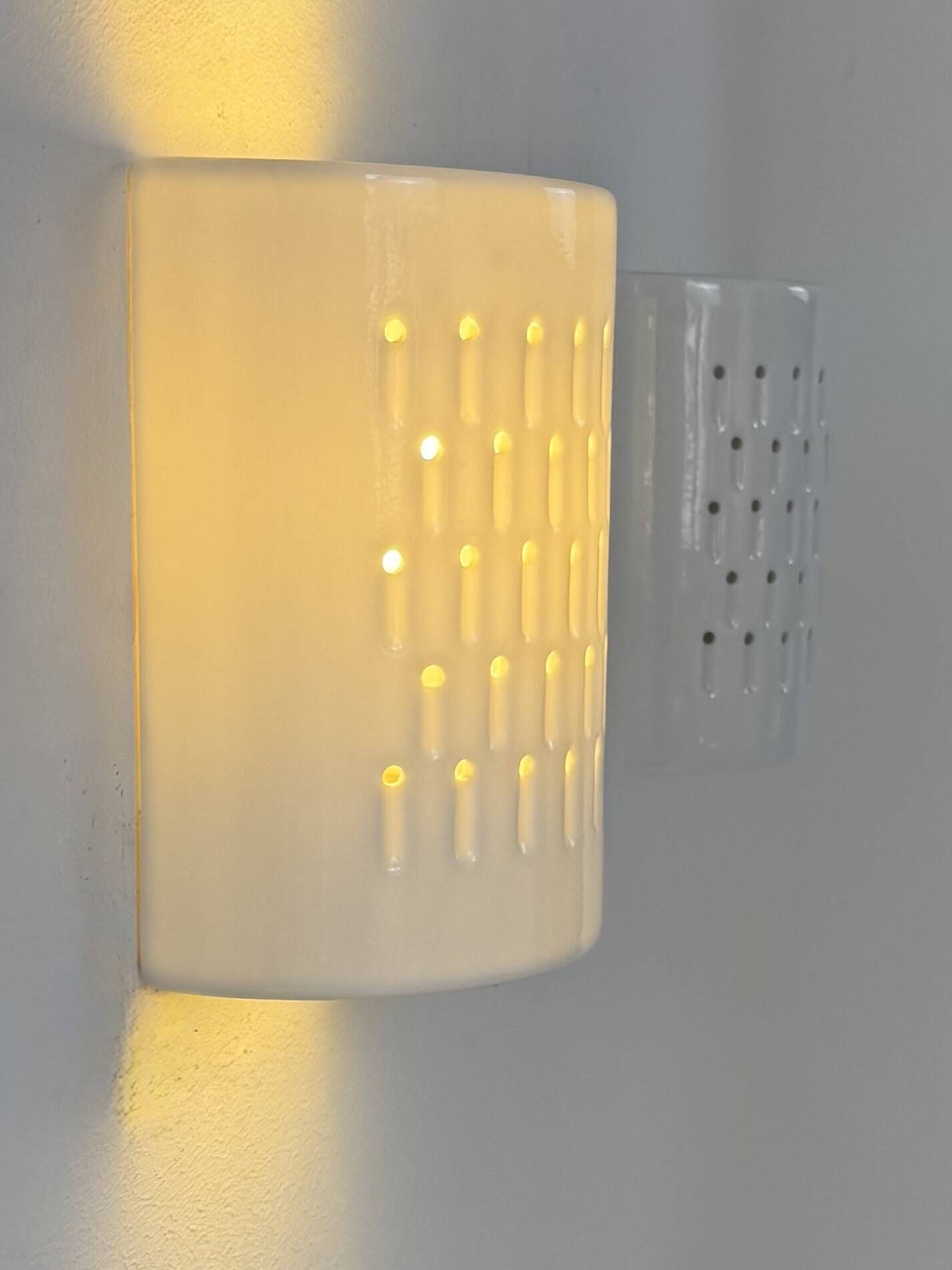 Pair of vintage wall lights in white porcelain, France, 1980.