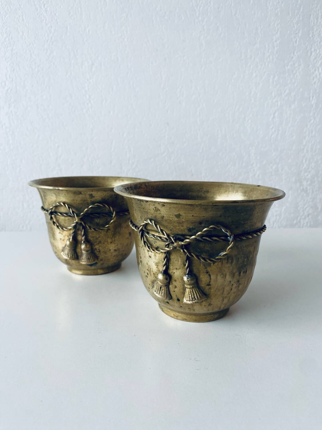 Pair of brass cord pot covers