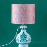Royal Delft blue-green ceramic table lamp with pink jacquard peacock shade.