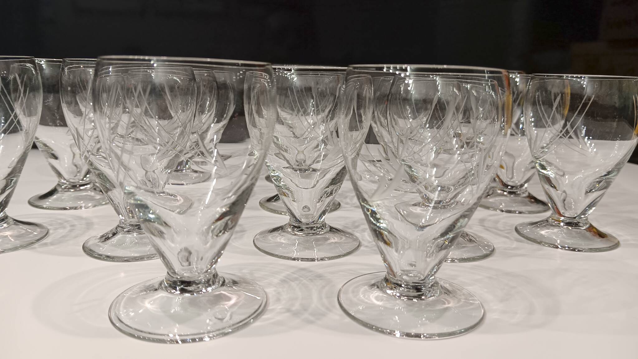 17 small crystal liquor glasses, chiseled pattern - Perfect condition.