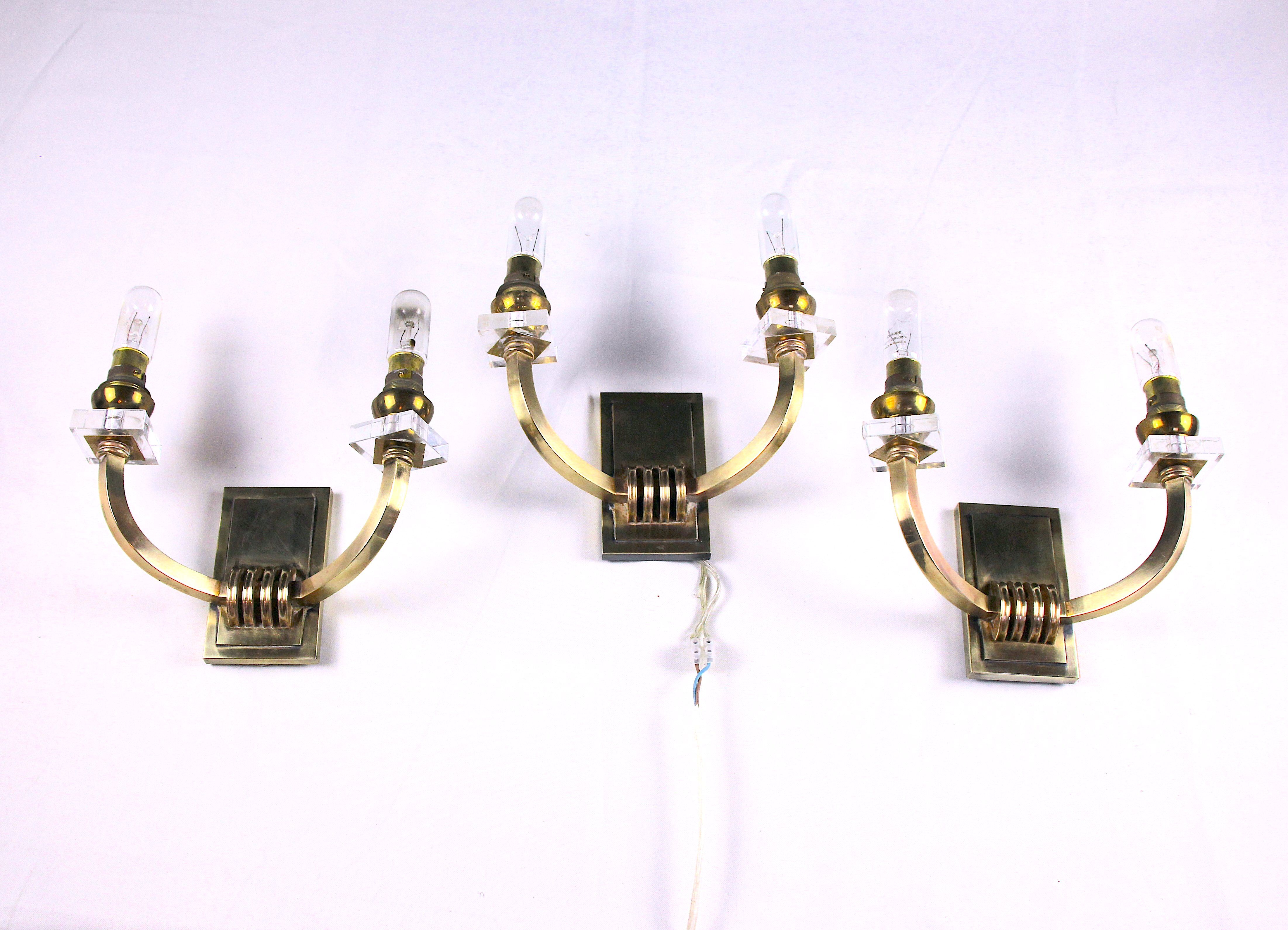 Three double wall lamps  Brass and lucite, France Mid-Century