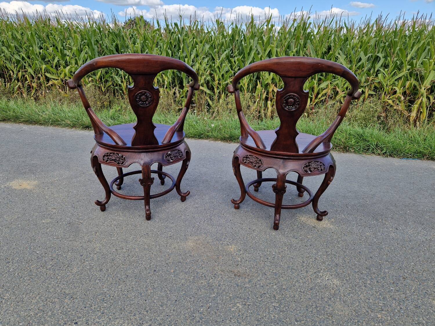 Pair of antique Chinese carved mahogany armchairs, circa 1960s