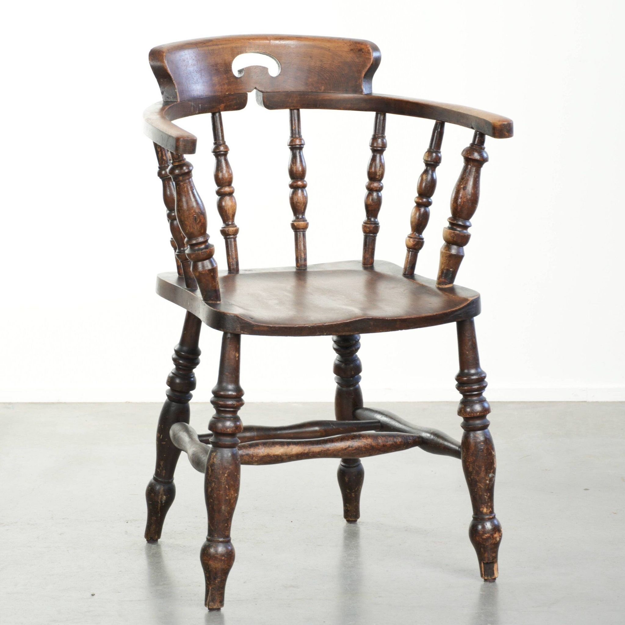 Wooden English antique pub/captain chair from the late 19th century