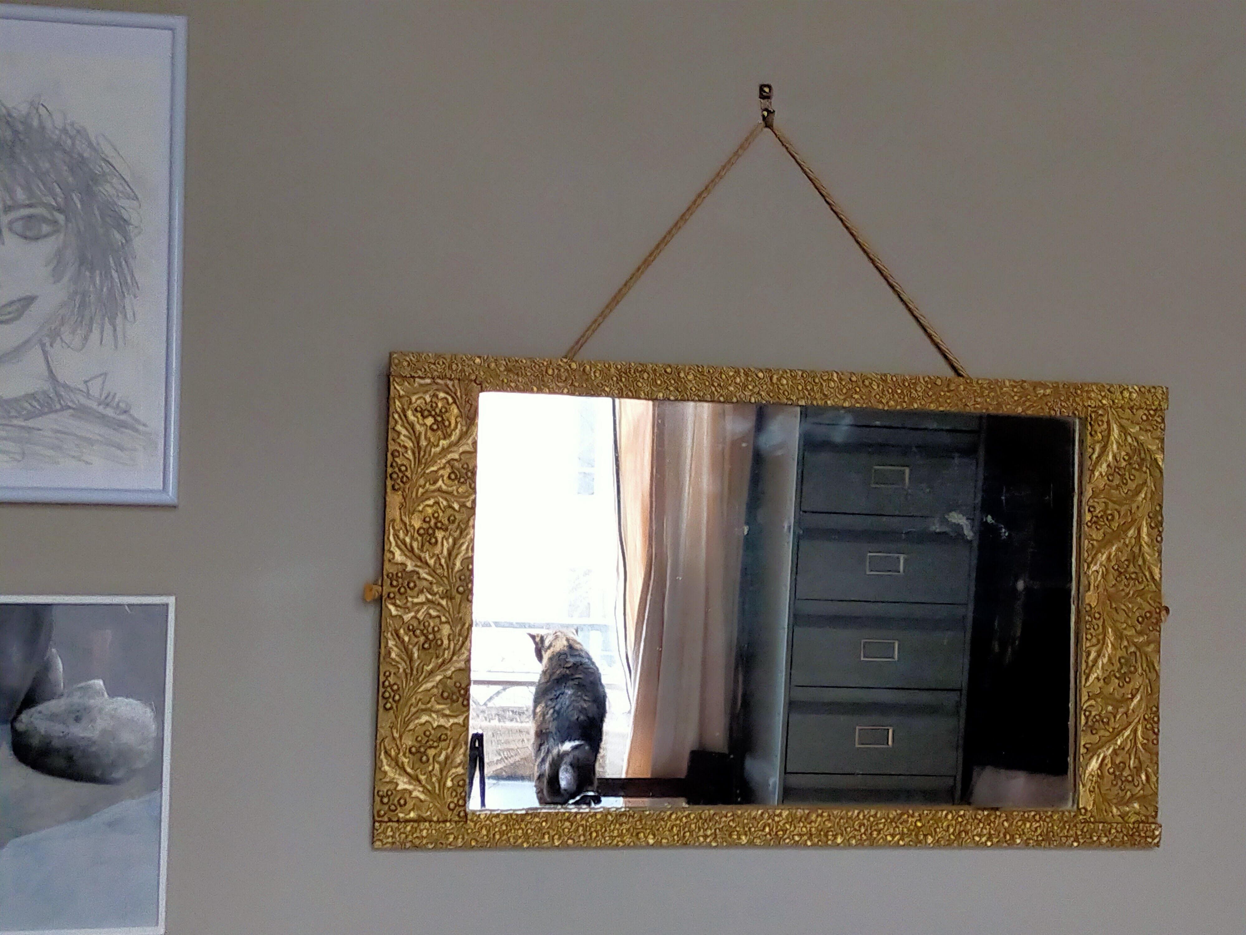 Art-deco gold mirror with vegetal décor  52x31cm