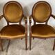 Paire de fauteuils médaillon en bois et velours
