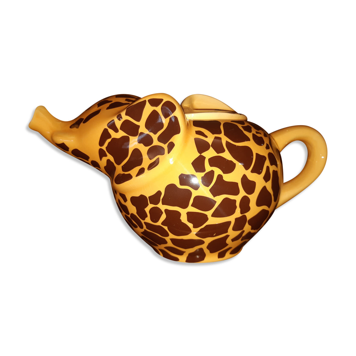 Elephant teapot decorated with giraffe cheetah, signed by the brand elephant 1896