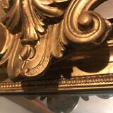 Large antique mirror with flagship shell in wood and gilded stucco