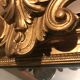 Large antique mirror with flagship shell in wood and gilded stucco