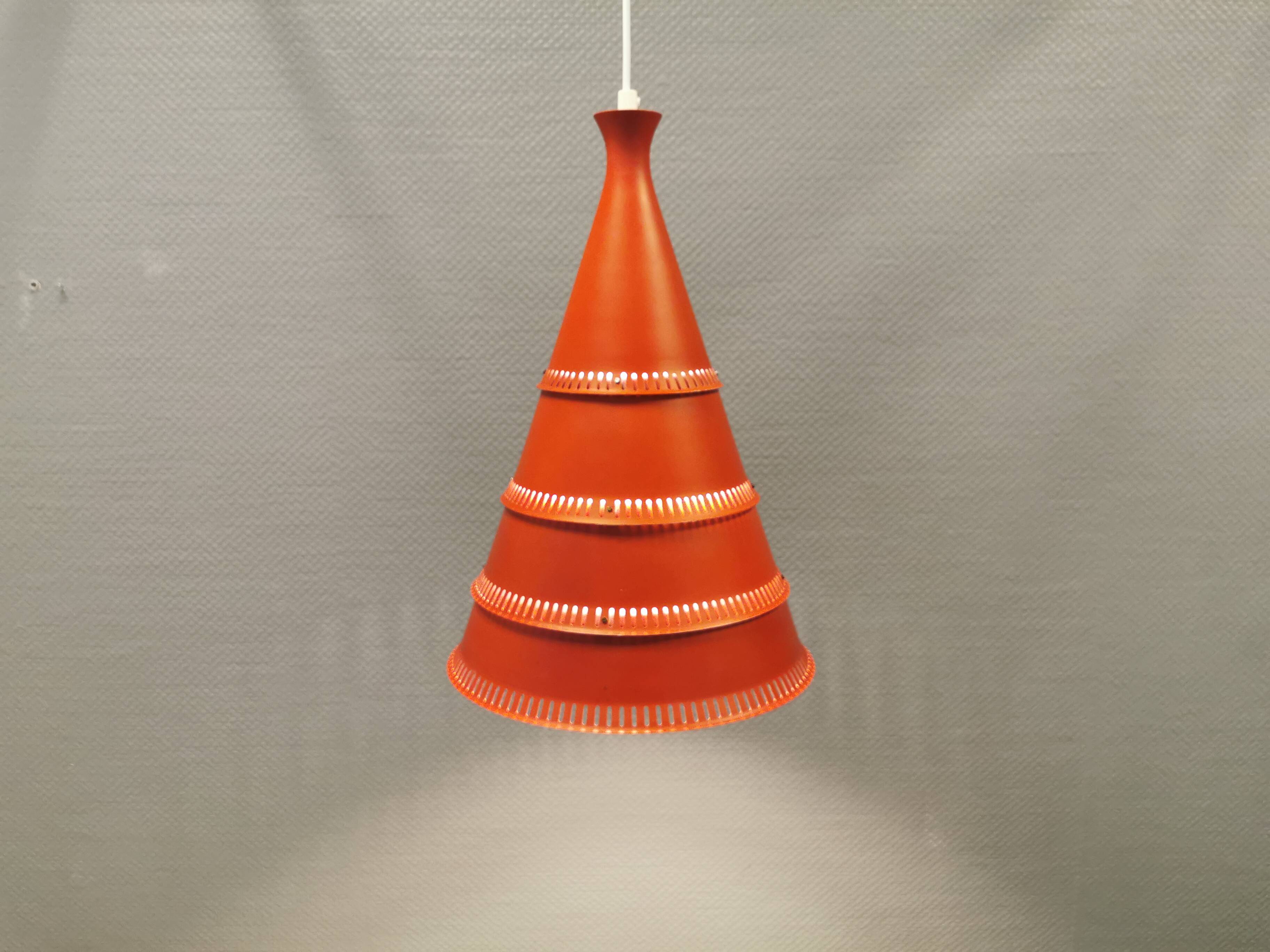 Knud Hjerting Metal layered cone-shaped hanging lamp with perforated detail on the edge. Model P208