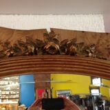 Mirror adorned with sculpted flowers