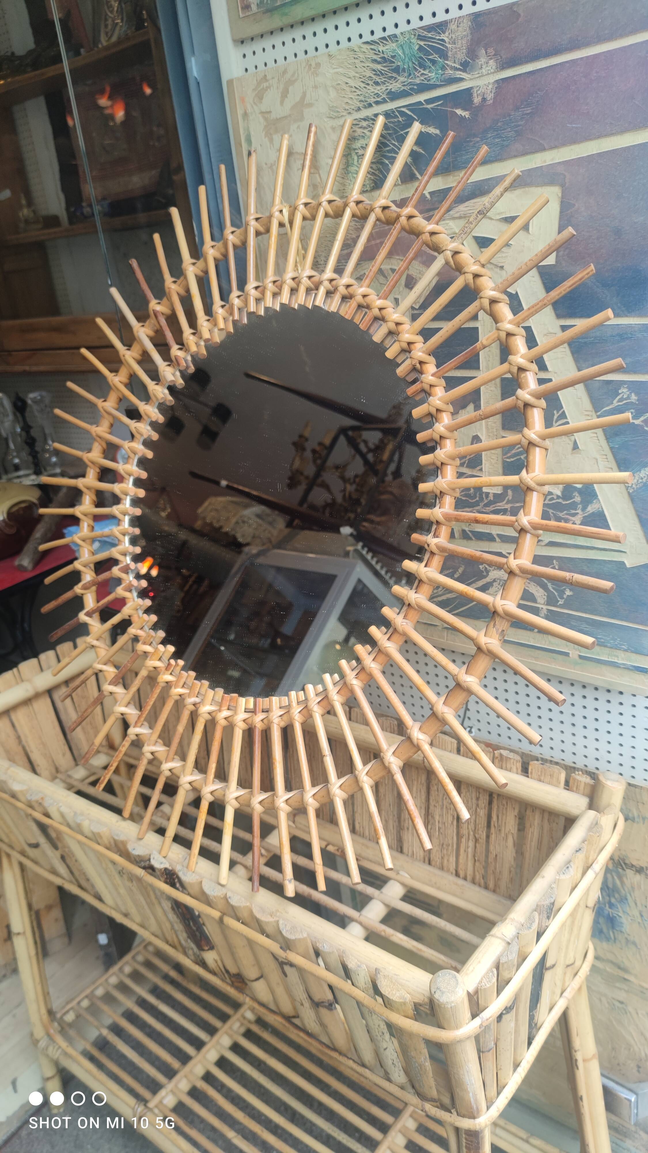 Rattan sunburst mirror, circa 1960, 72 cm in diameter