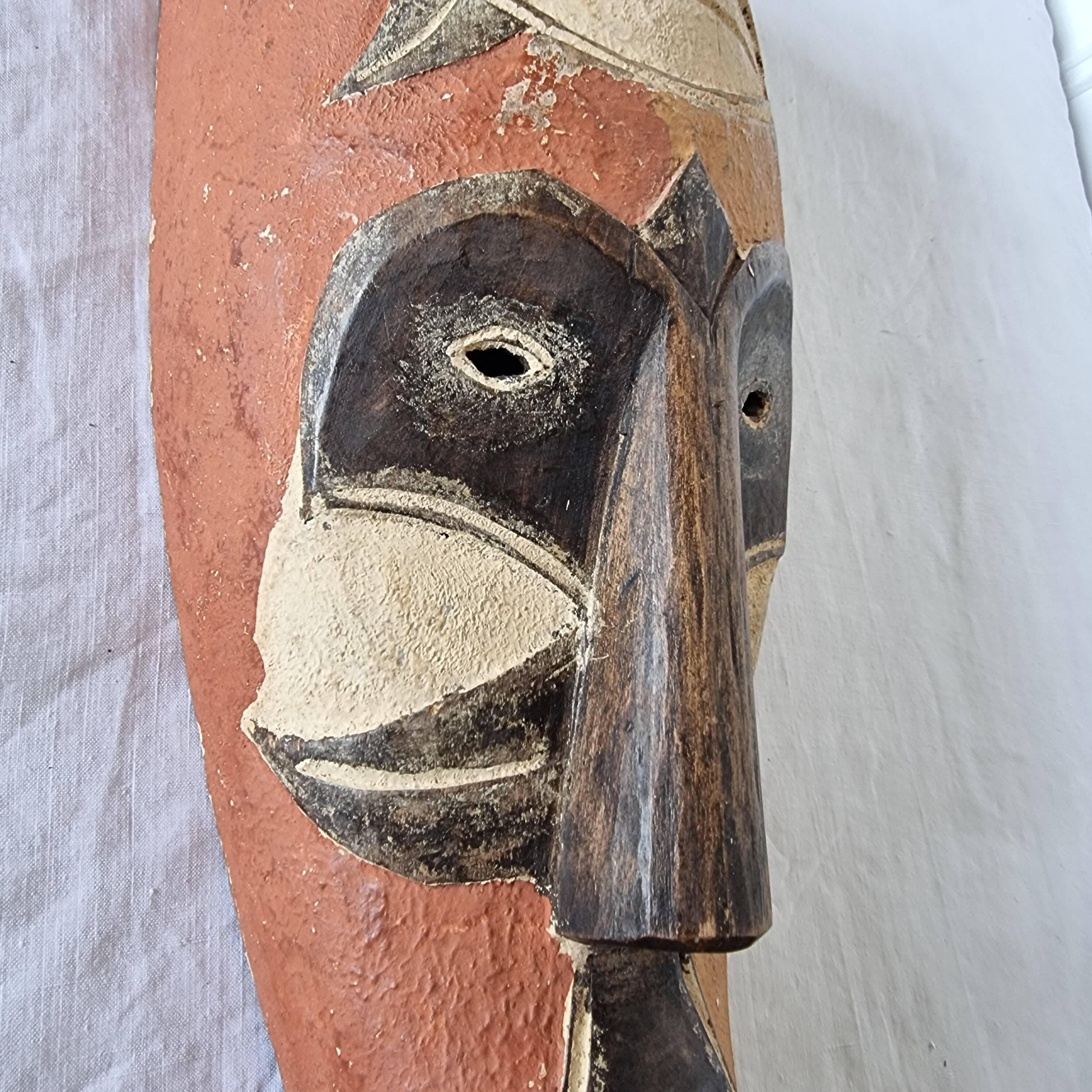 Wooden mask baule carved and hand painted with natural pigments from ivory coast