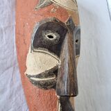 Wooden mask baule carved and hand painted with natural pigments from ivory coast