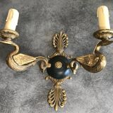 Antique bronze wall light with arm decorated with swans and palmettes in the Empire style