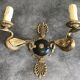 Antique bronze wall light with arm decorated with swans and palmettes in the Empire style