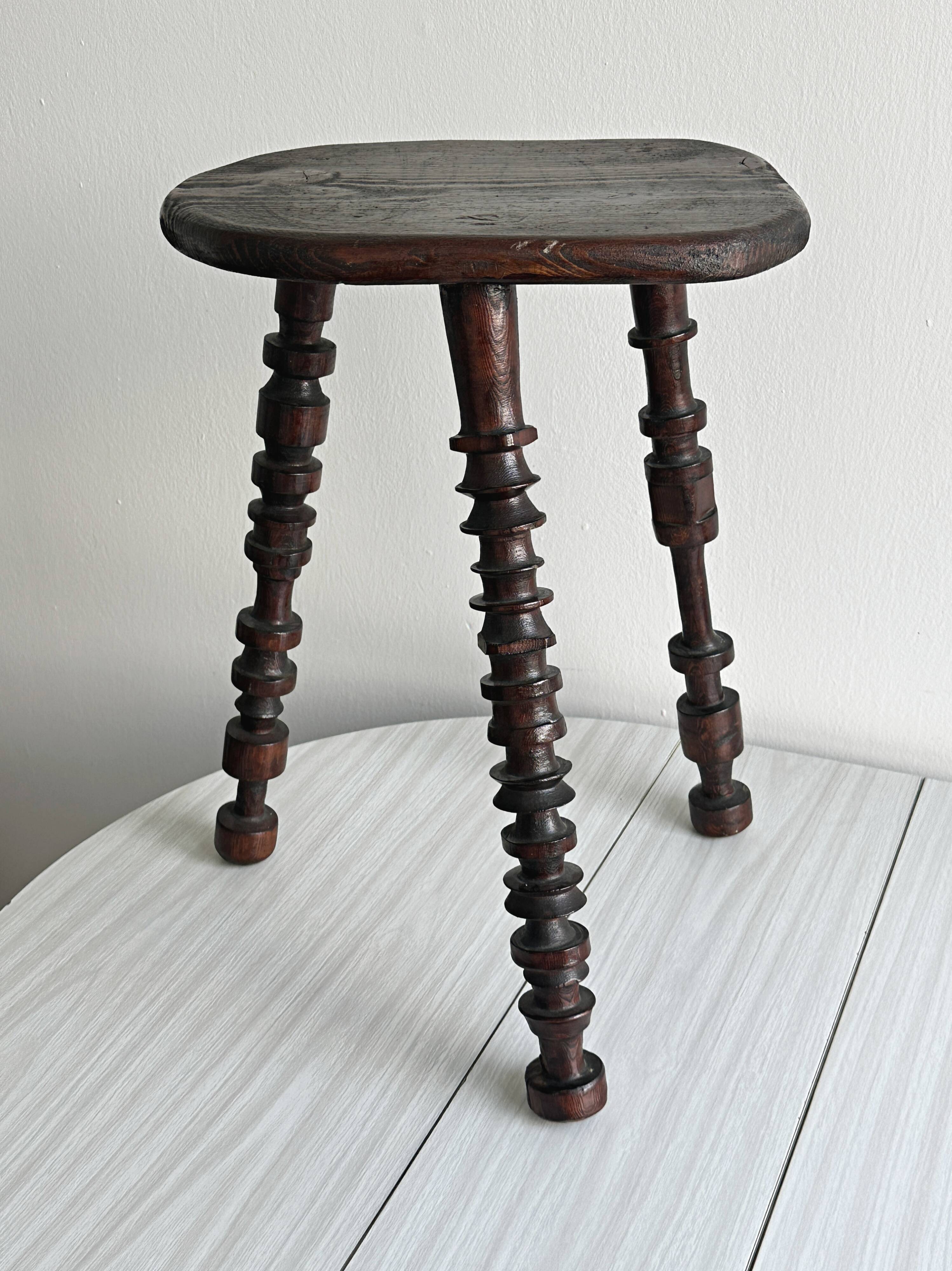 Antique dark wood tripod stool