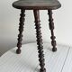Antique dark wood tripod stool