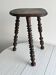 Antique dark wood tripod stool